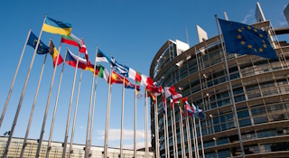 European Union flags outside the European Parliament building