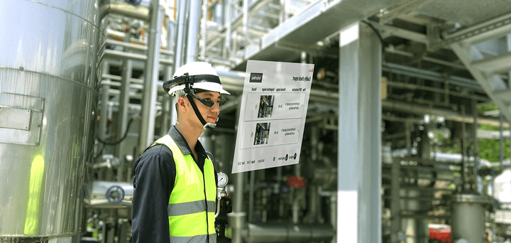 Worker wearing a headset in an industrial facility